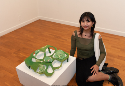 YC25 Student Artist Clare Dong poses with her piece 